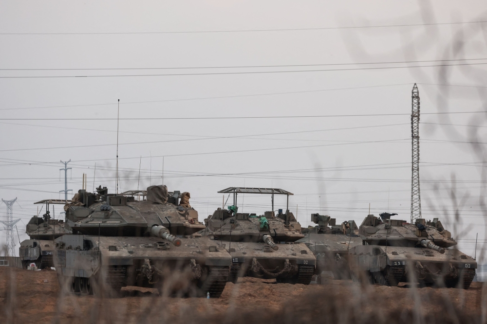 Israeli tanks are positioned near Israel's border with the Gaza Strip, in southern Israel, October 22, 2023. — Reuters pic
