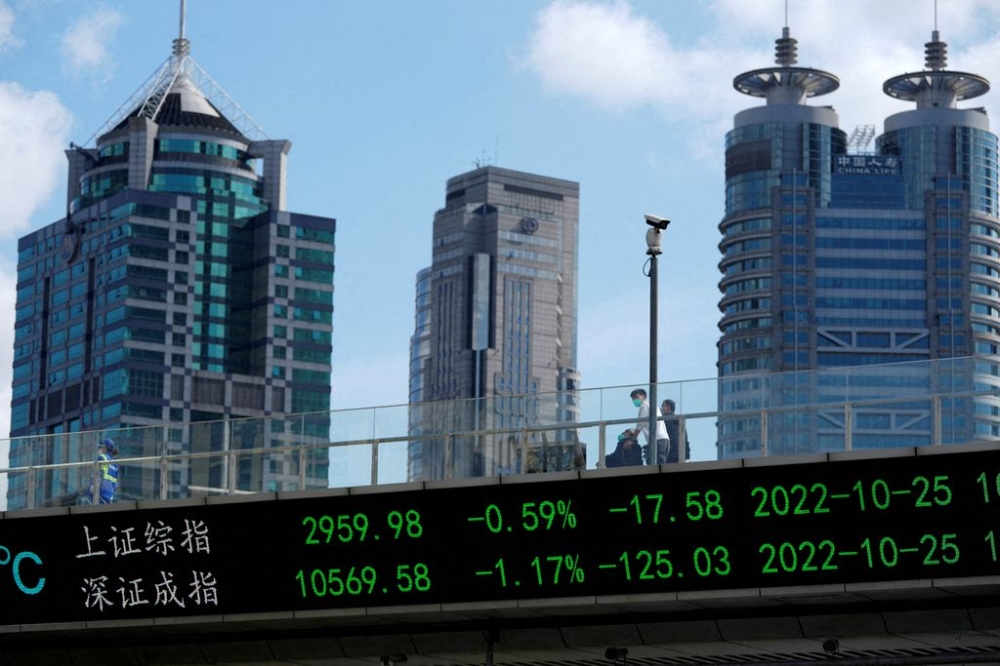 An electronic board shows Shanghai and Shenzhen stock indexes, at the Lujiazui financial district in Shanghai, China, October 25, 2022. — Reuters pic