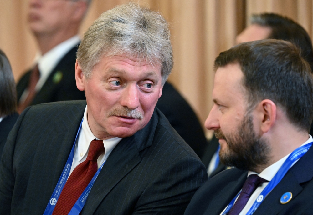 Kremlin spokesman Dmitry Peskov (left) said that the US was talking about an 'American-centric' world order that would not exist in future. — Reuters pic