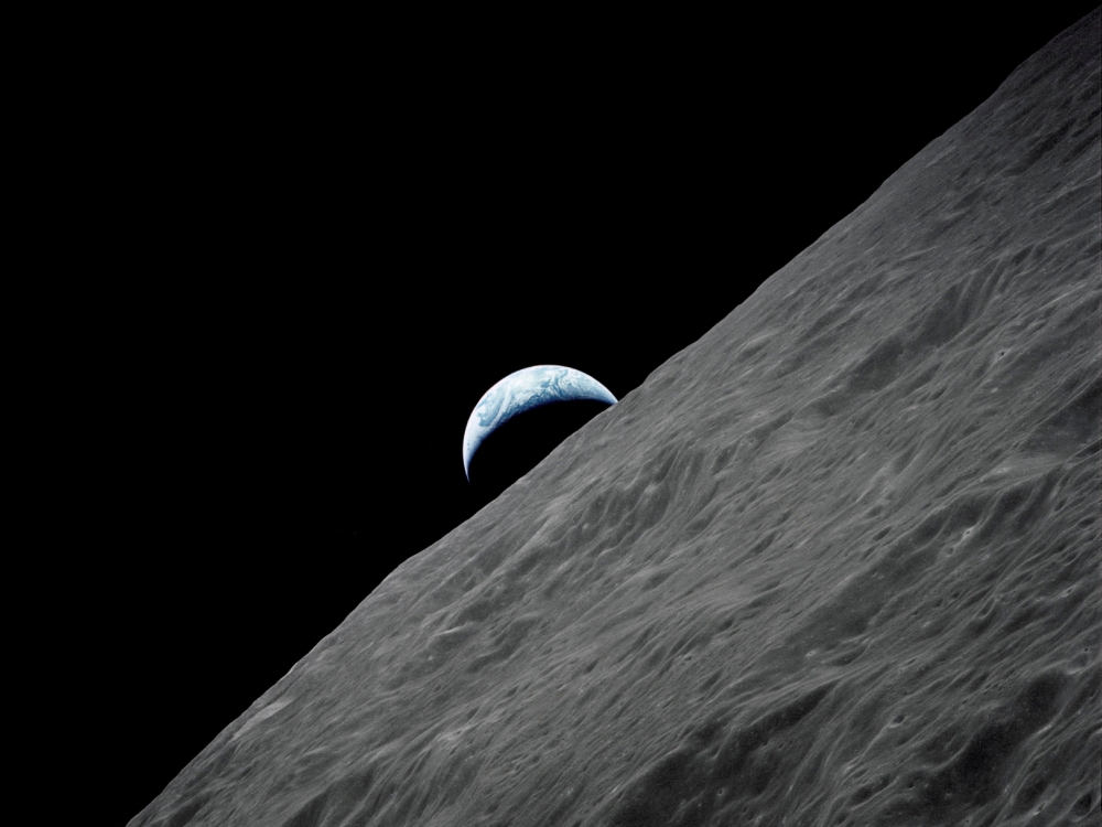 The crescent Earth rises above the lunar horizon in this undated Nasa handout photograph taken from the Apollo 17 spacecraft in lunar orbit during the final lunar landing mission in the Apollo programme in 1972. — Nasa handout pic via Reuters     