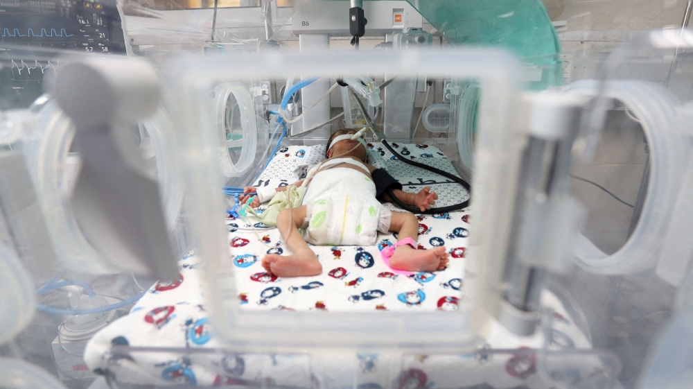 A premature Palestinian baby lies in an incubator at the maternity ward of Shifa Hospital, which according to health officials is about to shut down as it runs out of fuel and power, as the conflict between Israel and the Palestinian Islamist group Hamas continues, in Gaza City October 22, 2023. — Reuters pic