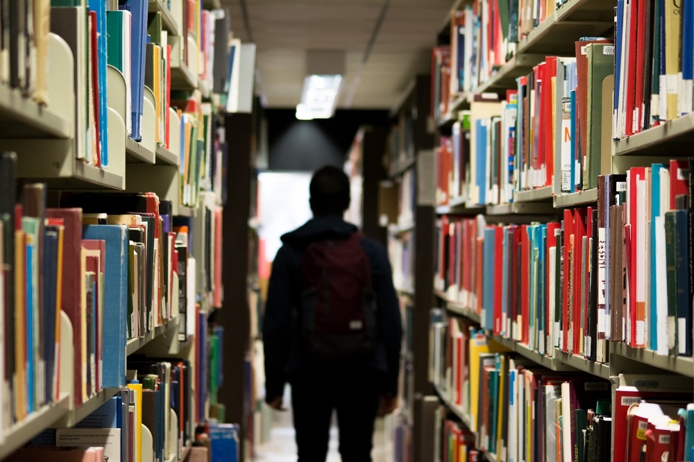 The writer says the point is a library today is no longer the place where people 'go to borrow and read books'. — Unsplash pic