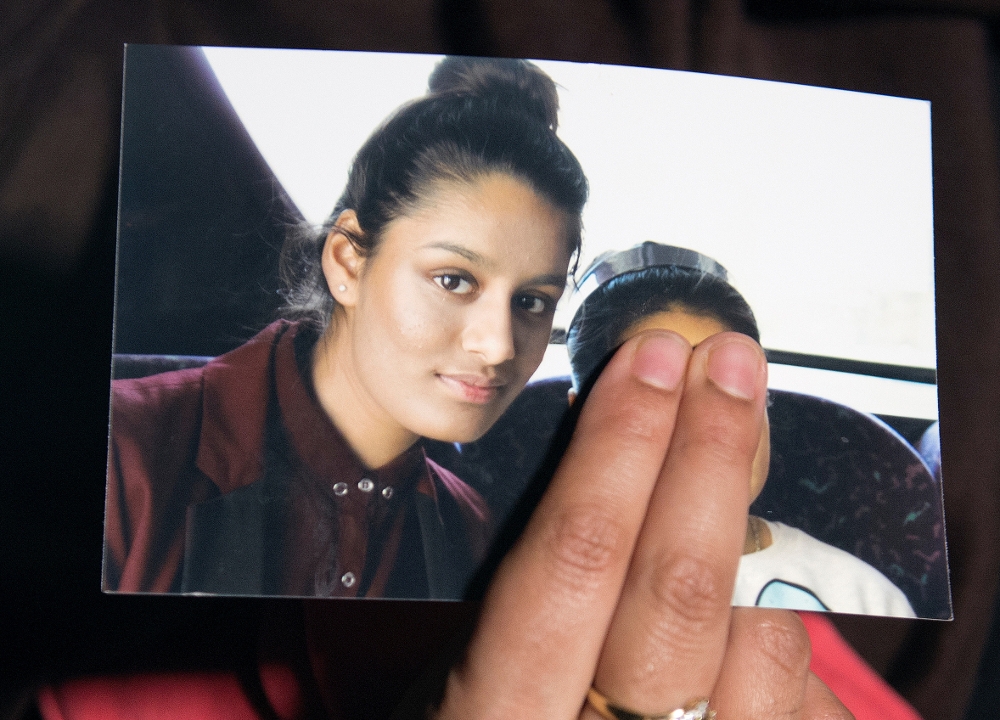 Renu Begum, sister of Shamima Begum, holds a photo of her sister as she makes an appeal for her to return home at Scotland Yard, in London February 22, 2015. — Reuters pic
