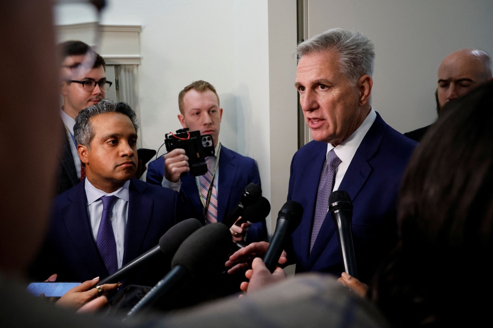US Rep. and former House Speaker Kevin McCarthy (R-CA) talks to reporters outside a House Republican conference meeting to choose a nominee in the race for Speaker of the House at the US Capitol in Washington October 24, 2023. — Reuters pic