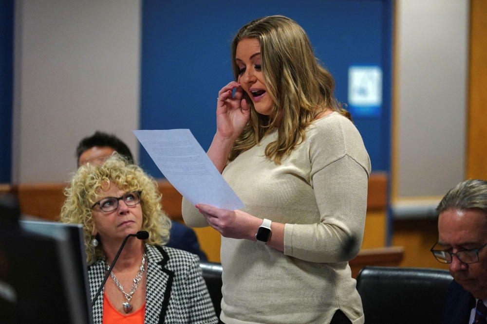 Jenna Ellis reads a statement after Ellis plead guilty to a felony count of aiding and abetting false statements and writings, inside Fulton Superior Court Judge Scott McAfee’s Fulton County Courtroom, October 24, 2023, in Atlanta, U.S.  Ellis, an attorney and prominent conservative media figure, reached a deal with prosecutors Tuesday, Oct. 24, 2023, and pleaded guilty to a reduced charge over efforts to overturn Donald Trump’s 2020 election loss in Georgia. — John Bazemore/Pool via Reuters