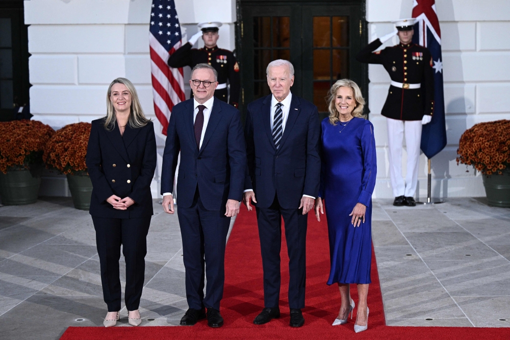 US President Joe Biden, First Lady Jill Biden, Australia Prime Minister Anthony Albanese and Jodie Haydon pose for pictures at the South Portico of the White House — AFP pic