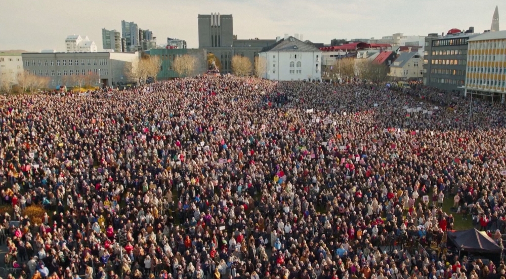 Demonstrators take part in a rally for equal rights, as Icelandic women strike for equality, in Reykjavik, Iceland. — AFP pic
