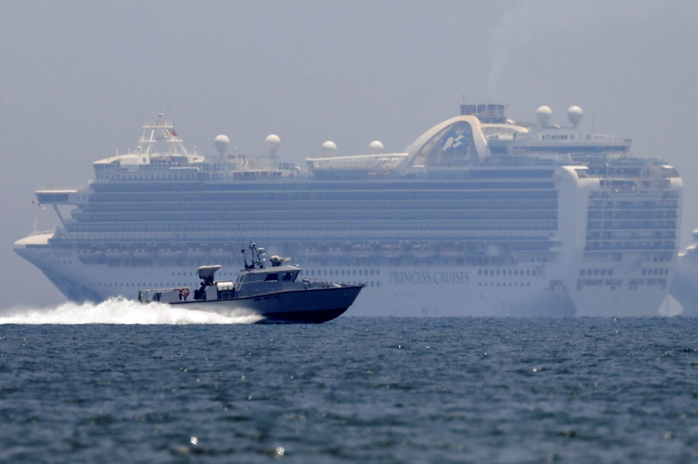 A patrol boat sails past the Princess Cruises’ Ruby Princess cruise ship as it docks in Manila Bay, Philippines on May 7, 2020. — Reuters pic 