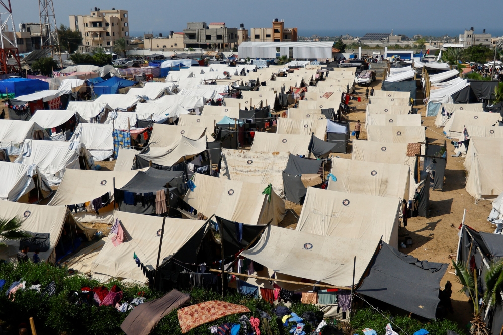 Palestinians, who fled their houses amid Israeli strikes, take shelter in a tent camp at a United Nations-run centre, after Israel’s call for more than one million civilians in northern Gaza to move south, in Khan Younis in the southern Gaza Strip, October 23, 2023. — Reuters pic 