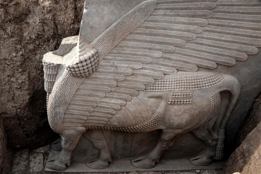 This picture taken on October 24, 2023 shows a view of a newly-unearthed Assyrian Lamassu (human-headed winged bull) sculpture discovered with its entire wings intact by the French archaeological mission at the archaeological site of Khorsabad (also known as Dur-Sharrukin). — AFP pic