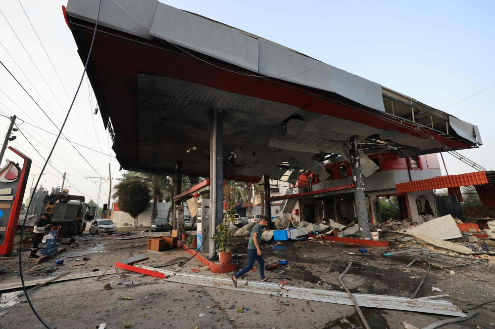 A petrol station hit in an Israeli strike. — AFP pic