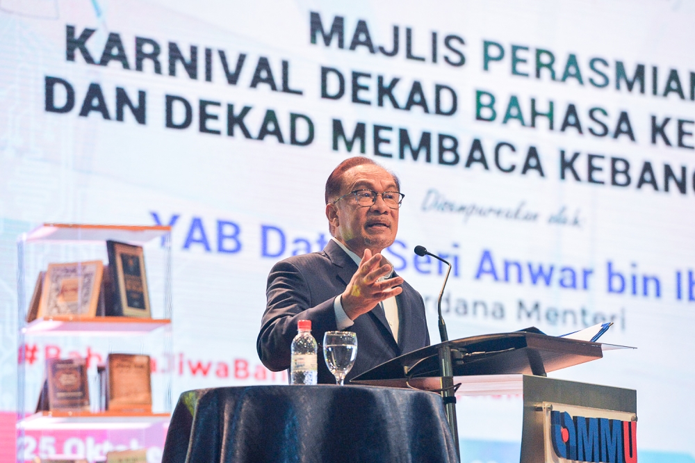 Prime Minister Datuk Seri Anwar Ibrahim gives a speech during the Karnival Dekad Bahasa Kebangsaan dan Dekad Membaca Kebangsaan in Cyberjaya on October 25,2023. — Picture by Miera Zulyana