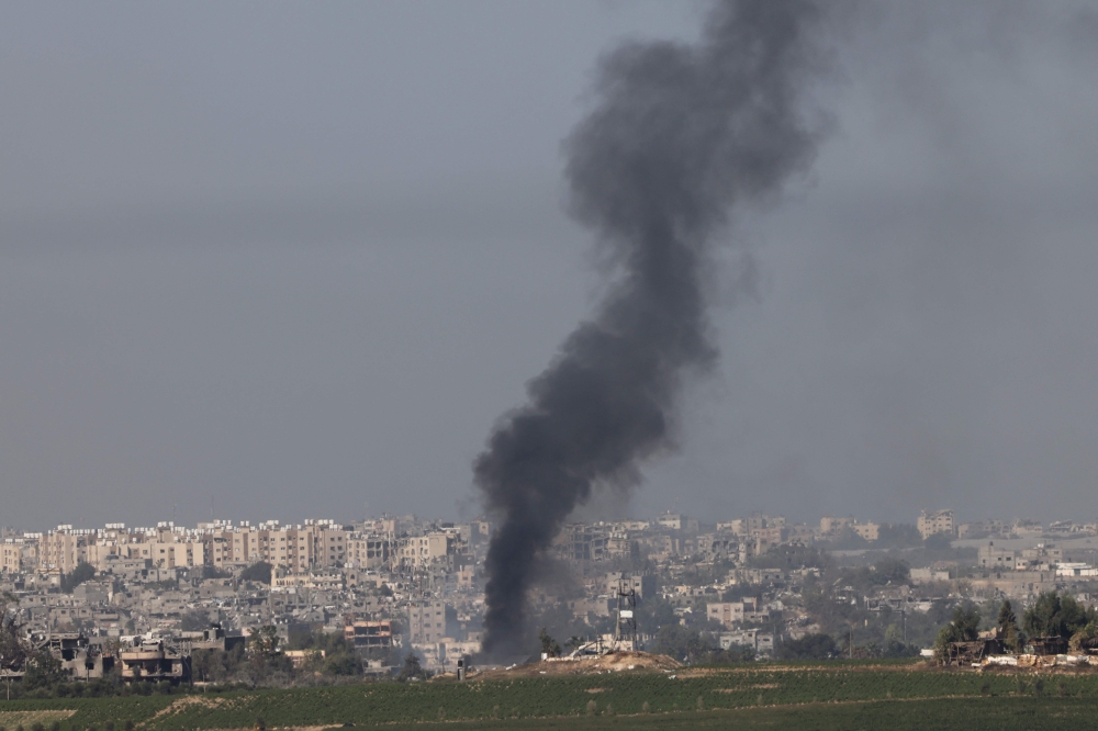 A picture taken from the southern Israeli city of Sderot on October 26, 2023 shows black smoke billowing over the northern Gaza Strip, amid the ongoing war between Israel and the Palestinian group Hamas. — AFP pic 