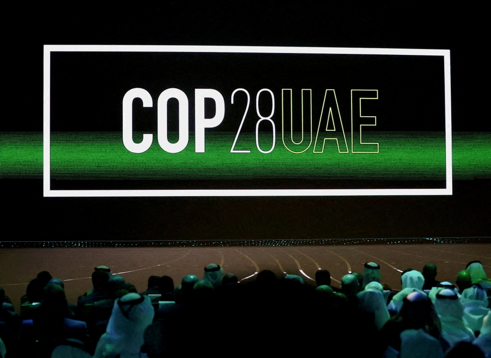 ‘Cop28 UAE’ logo is displayed on the screen during the opening ceremony of Abu Dhabi Sustainability Week (ADSW) under the theme of ‘United on Climate Action Toward COP28’, in Abu Dhabi January 16, 2023.