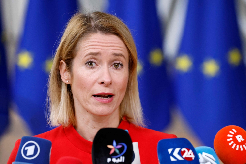 Estonia’s Prime Minister Kaja Kallas talks to the press as she arrives for the second and last day of a European Union summit, at the EU headquarters in Brussels October 27, 2023. — AFP pic