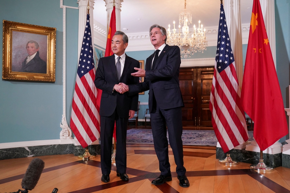 US Secretary of State Antony Blinken shakes hands with Chinese Foreign Minister Wang Yi as they meet at the State Department in Washington October 26, 2023. — Reuters pic