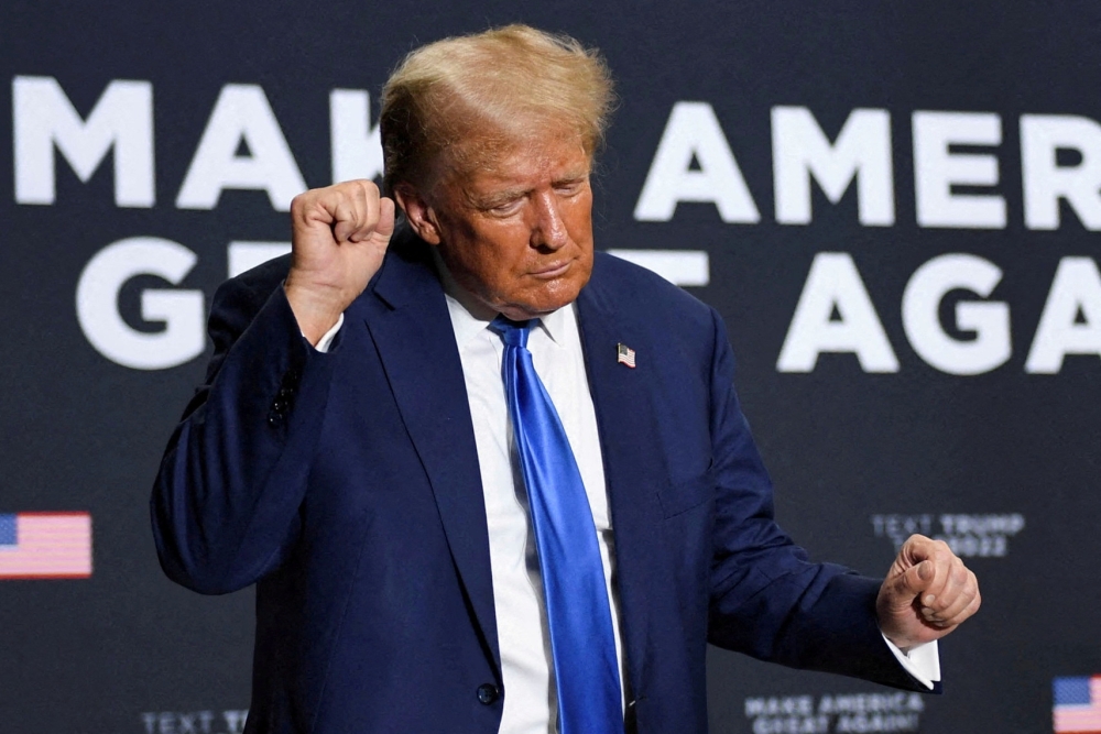 File photo of Republican presidential candidate and former US President Donald Trump dancing for the crowd after he spoke at a campaign rally in Derry, New Hampshire, US, October 23, 2023. — Reuters pic
