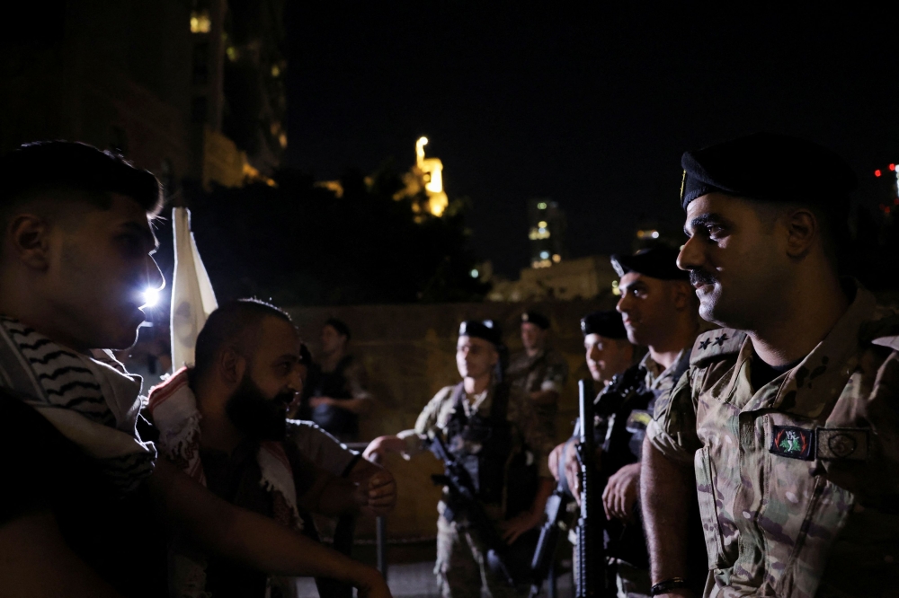 Military personnel stand guard in the vicinity of the French embassy, as people protest in solidarity with Palestinians in Gaza, in Beirut, Lebanon, October 27, 2023. — AFP pic