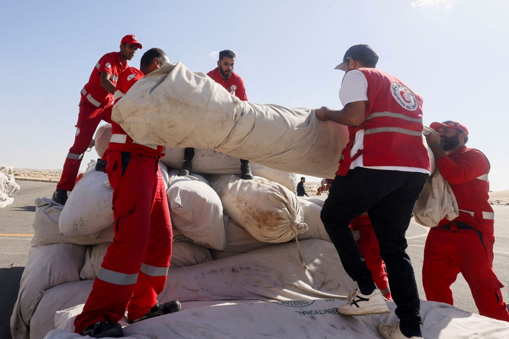 File photo of Egyptian Red Crescent members coordinating aid for Gaza, after United Nations Secretary-General Antonio Guterres visited the Rafah border crossing between Egypt and the Gaza Strip, at Al Arish Airport, Egypt, October 20, 2023. — Reuters pic