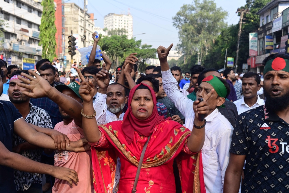 Bangladesh Nationalist party (BNP) activists shout slogans during a rally in Dhaka on October 28, 2023, to demand of the resignation of the current government, the establishment of a non-partisan neutral government and the release of BNP chairperson Begum Khaleda Zia. — AFP pic