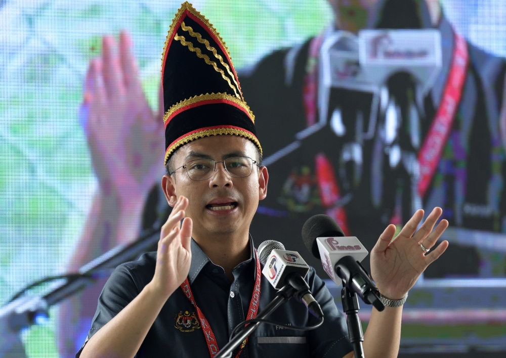Communications and Digital Minister Fahmi Fadzil delivers a speech during the ‘Kita Madani’ programme at Dewan Pisompuruan, Kampung Kobuni, Inanam October 28, 2023. — Bernama pic