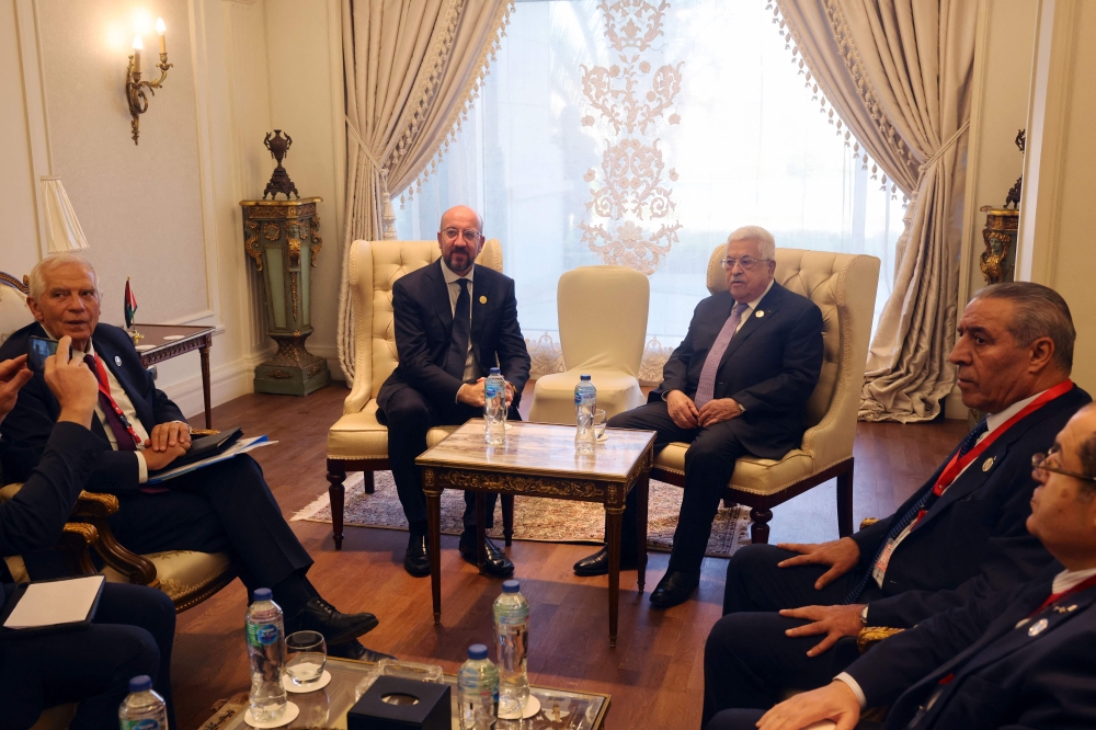 File phot of a handout picture provided by the Palestinian Authority’s press office (PPO) shows Palestinian president Mahmud Abbas (centre right) meeting with European Council President Charles Michel (centre left) and High Representative of the European Union for Foreign Affairs and Security Policy Josep Borrell (left) on the side-lines of the International Peace Summit in the New Administrative Capital about 45 kilometres east of Cairo, on October 21, 2023. — AFP pic