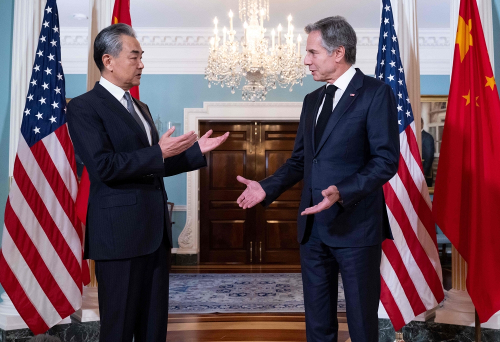 US Secretary of State Antony Blinken speaks with Chinese Foreign Minister Wang Yi prior to meetings at the State Department in Washington, DC on Thursday. — AFP pic