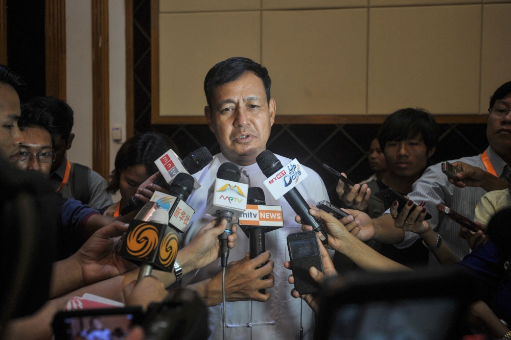 Ye Htut, then Myanmar’s Minister of Information talks to the media after meetings at the president’s office in Naypyidaw on October 31, 2014. — AFP pic