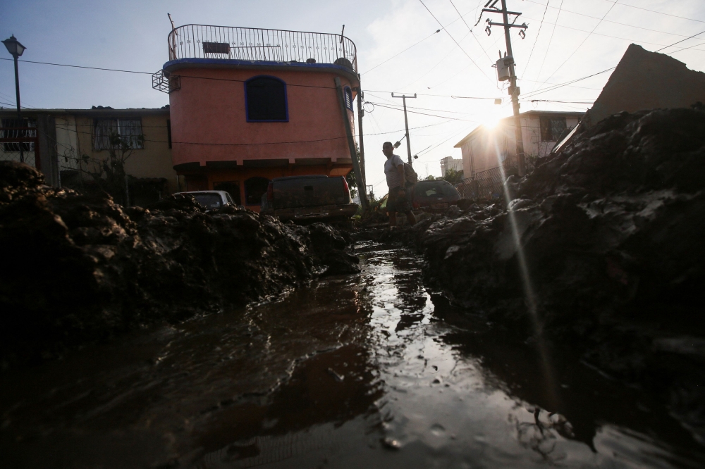 A man walks in the mud, in the aftermath of Hurricane Otis, in Acapulco, Mexico, October 29, 2023. — Reuters pic
