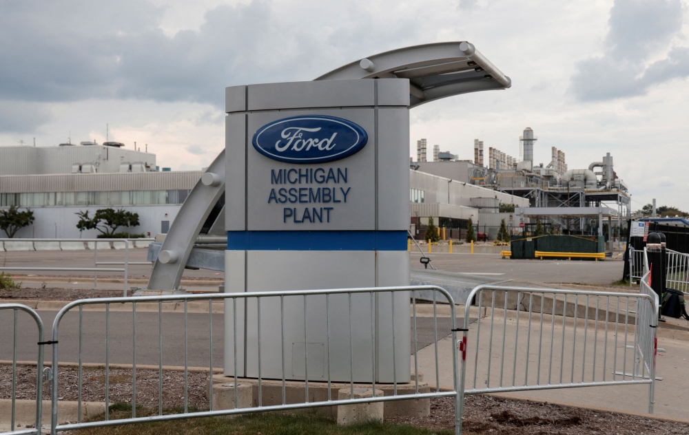 An empty employee parking lot is seen gated shut at the Ford Michigan Assembly Plant in Wayne, Michigan September 17, 2023. — Reuters pic