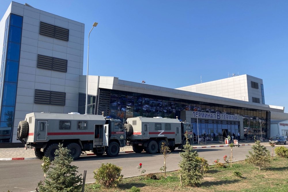 This photograph shows Russian National Guard (Rosgvardiya) vans parked at the airport in Makhachkala on October 30, 2023. — AFP pic
