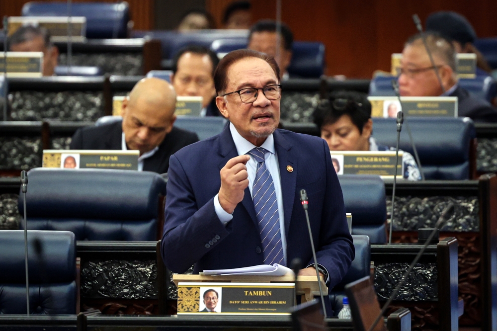 Prime Minister Datuk Seri Anwar Ibrahim speaks at the Parliament in Kuala Lumpur October 31, 2023. — Bernama pic