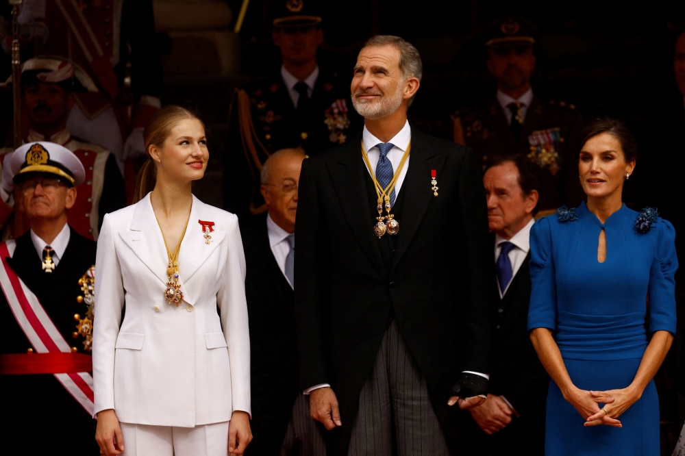 Spain’s Princess Leonor, King Felipe and Queen Letizia prepare to watch a military parade after the princess swore an oath to the Constitution, during a ceremony at Parliament in Madrid, Spain, October 31, 2023. — Reuters pic