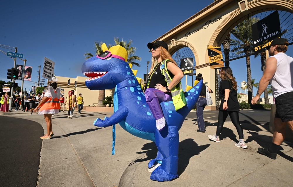 SAG-Aftra members dress in costume for Halloween as they walk the picket line outside Paramount Studios in Los Angeles October 31, 2023. — AFP pic