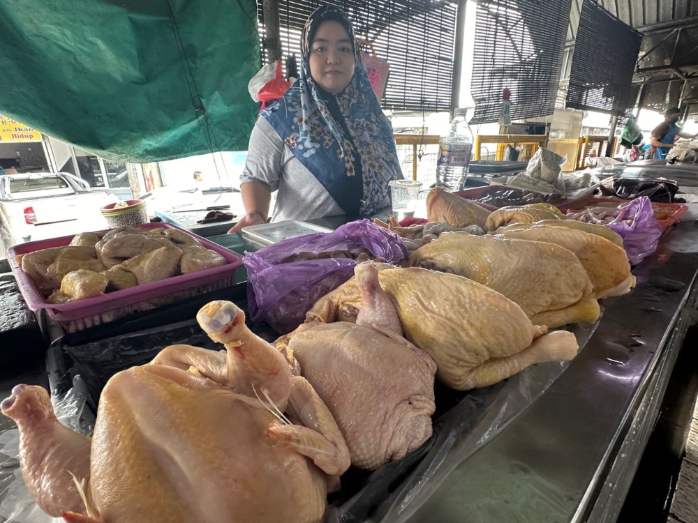 Fairuz, at her stall in Sibu Central Market. — Picture by Borhaniza Ali Basah