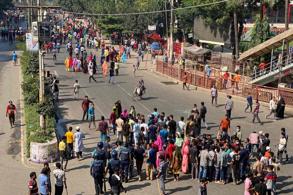 Garment workers block roads as they take part in a protest in Dhaka on November 1, 2023. — AFP pic