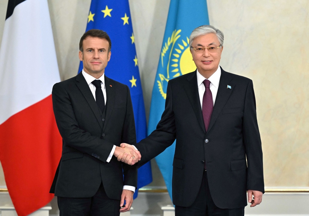 Kazakh President Kassym-Jomart Tokayev shakes hands with French President Emmanuel Macron during a meeting in Astana, Kazakhstan November 1, 2023. — Press service of the President of Kazakhstan handout pic via Reuters