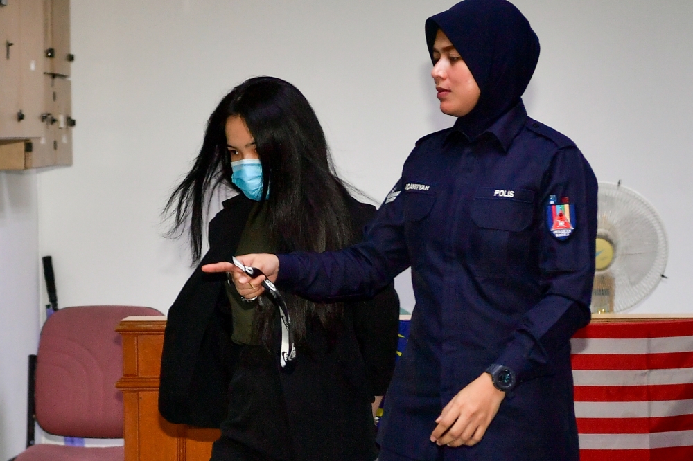 Tai Zee Sing, 31, was charged with knowingly making and initiating the transmission of offensive communication that is ‘Can hired killer to kill new prime minister’, on the Penny Tai Facebook profile, with the intention to hurt the feelings of other people. — Bernama pic 
