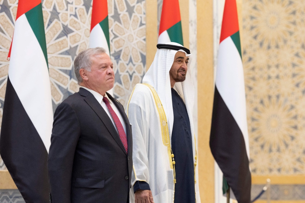 This handout picture provided by the UAE Presidential Court shows Emirati President Sheikh Mohamed bin Zayed al-Nahyan (right) receiving Jordanian King Abdullah II during a state visit reception at Abu Dhabi’s Qasr Al Watan presidential palace on November 1, 2023. — UAE Presidential Court handout pic via AFP  