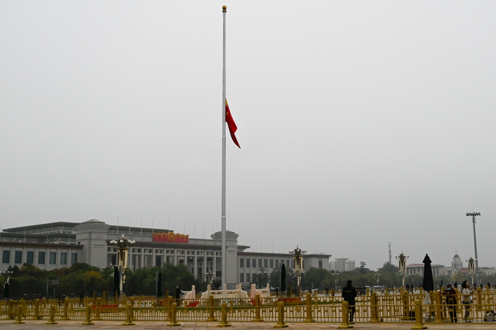 The Chinese national flag flies at half-mast for the passing of former Chinese premier Li Keqiang, at Tiananmen Square in Beijing on November 2, 2023. — AFP pic