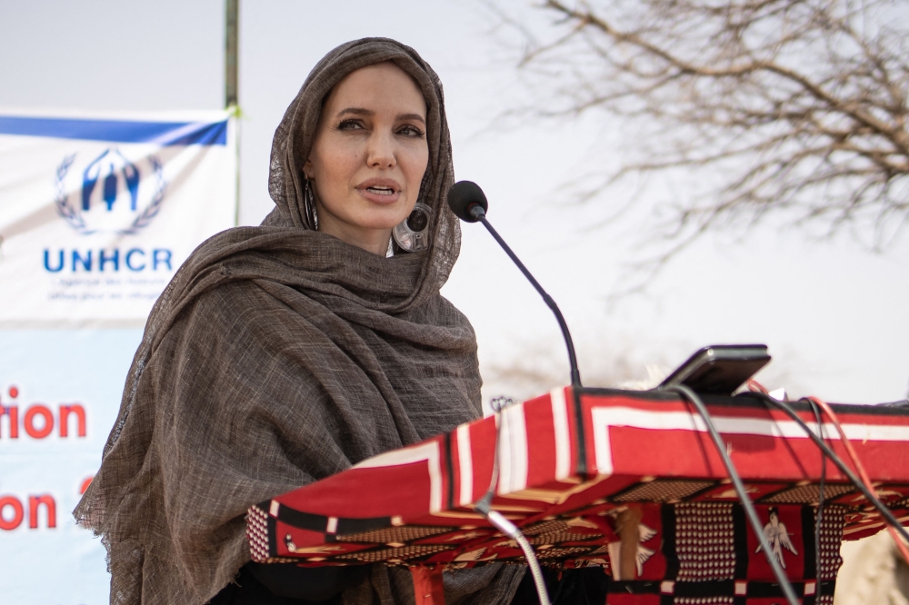 File photo of US actress Angelina Jolie giving a statement in Goudebou, a camp that welcomes more than 11,000 Malian refugees in northern Burkina Faso, on International Refugee Day June 20, 2021. — AFP pic