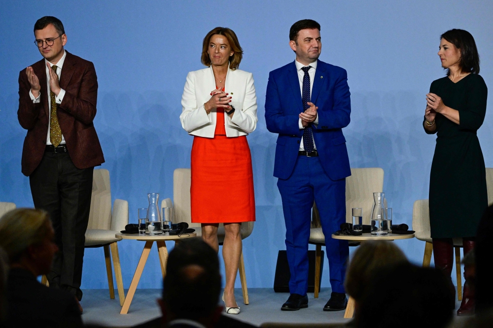 (From left) Ukraine’s Foreign Minister Dmytro Kuleba, Slovenia’s Foreign Minister Tanja Fajon, North Macedonia’s Foreign Minister Bujar Osmani and German Foreign Minister Annalena Baerbock applaud at the end of a panel discussion during a Ministerial Conference on the issues of EU enlargement, EU reforms and the EU’s global capacity at the Federal Foreign Office in Berlin November 2, 2023. — AFP pic