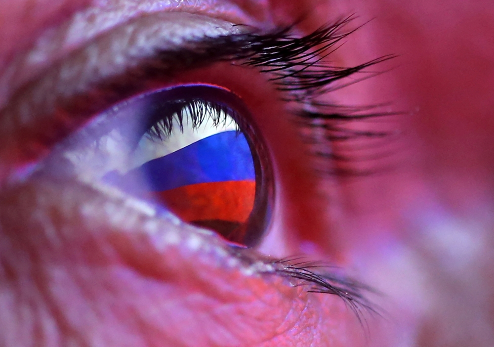 A Russian flag is reflected in an eye in this picture illustration taken October 4, 2018. — Reuters pic