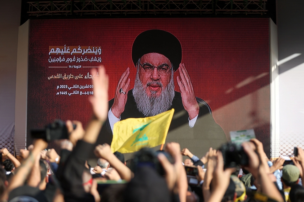 Lebanon’s Hezbollah leader Sayyed Hassan Nasrallah appears on a screen as he addresses his supporters during a ceremony to honour fighters killed in the recent escalation with Israel, in Beirut’s southern suburbs, Lebanon November 3, 2023. — AFP pic 