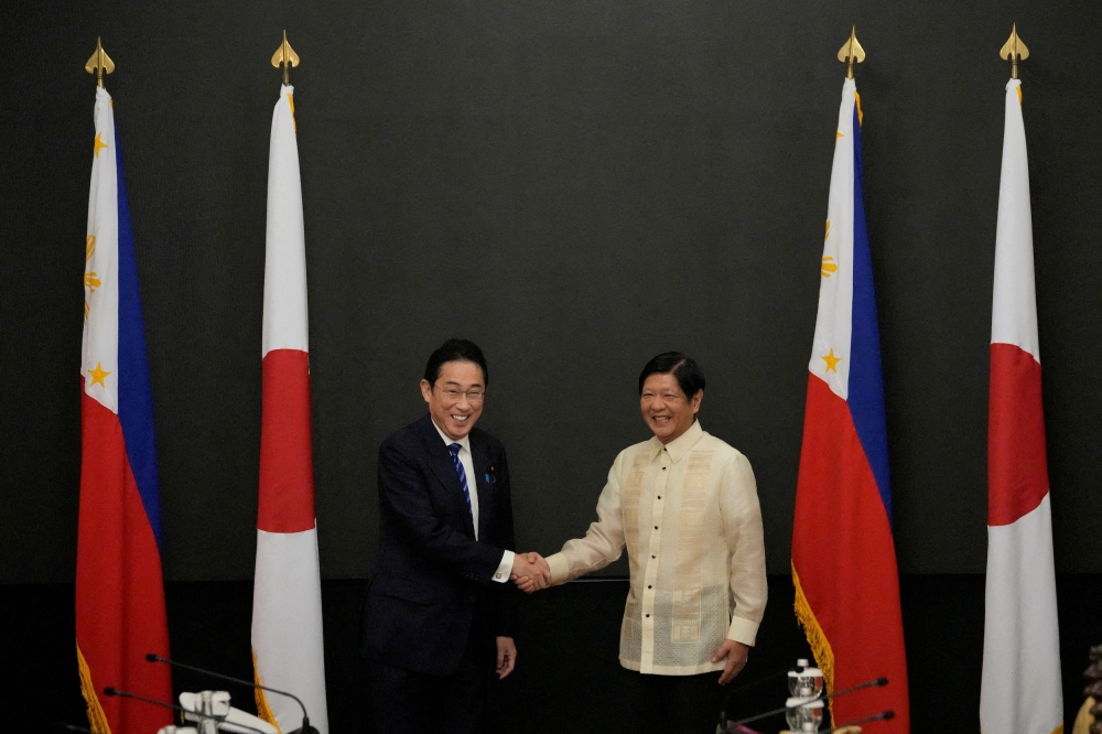 Japan Prime Minister Fumio Kishida shakes hands with Philippine President Ferdinand 'Bongbong' Marcos Jr at Malacanang Palace in Manila November 3, 2023. — Pool pic via Reuters