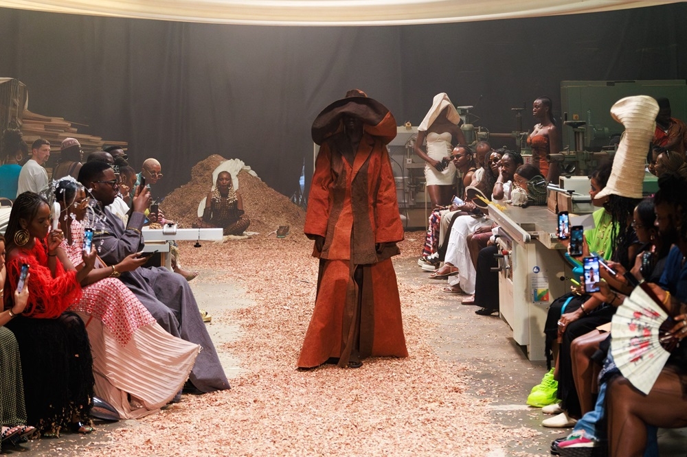 A model wearing clothes by Nigerian fashion designer Bubu Ogisi walks down the runway at her fashion show, Shadows, in Lagos. — AFP pic