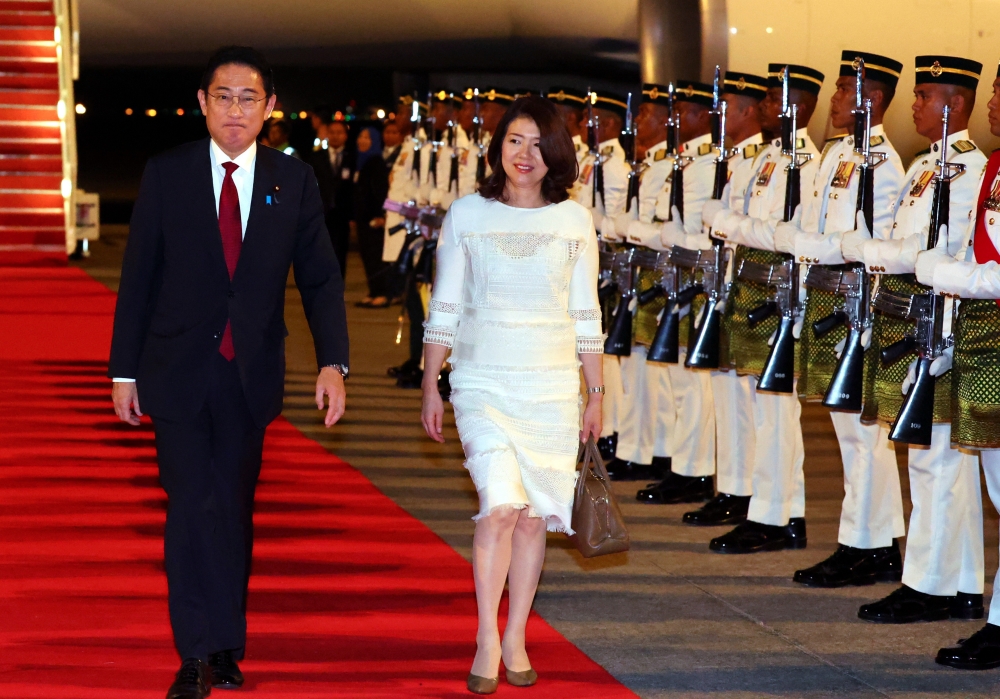 Japanese Prime Minister Fumio Kishida and spouse Yuko Kishida walk past a guard of honour by members of the 1st Battalion of the Royal Ranger Regiment after arriving at Kuala Lumpur International Airport Bunga Raya Complex to begin a two-day working visit to Malaysia November 4, 2023. — Bernama pic