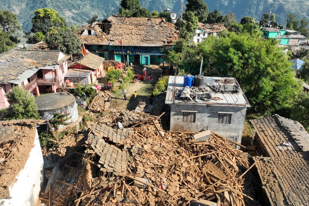 At least 157 people were killed in an overnight earthquake that struck a remote pocket of Nepal, officials said yesterday, as security forces rushed to assist with rescue efforts. — AFP pic