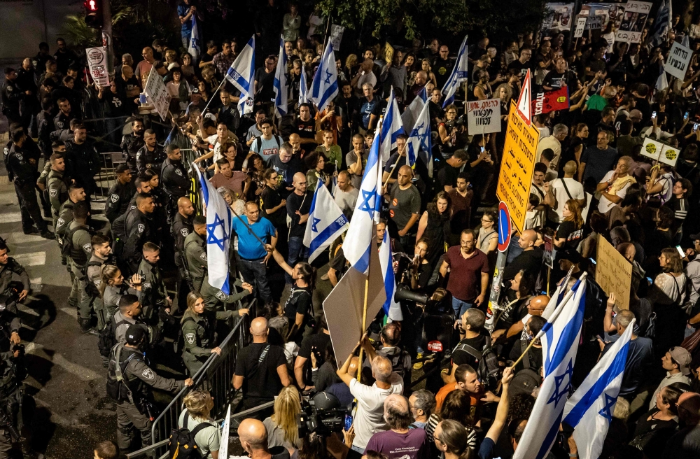 Thousands demonstrated in Israel yesterday, as pressure mounts on Prime Minister Benjamin Netanyahu over his government’s lack of preparedness for the October 7 attacks and its handling of the ensuing hostage crisis. — AFP pic