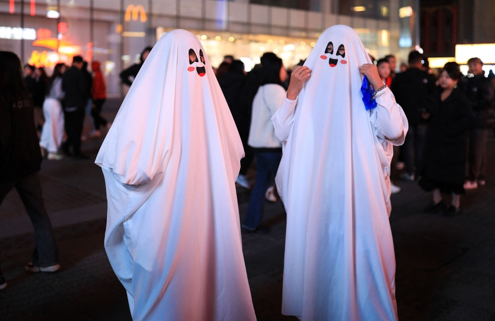 Seven Cuban officials with state-run music organisations have been punished after helping organise a Halloween party last week where an Adolf Hitler costume won first prize, officials said. — AFP pic